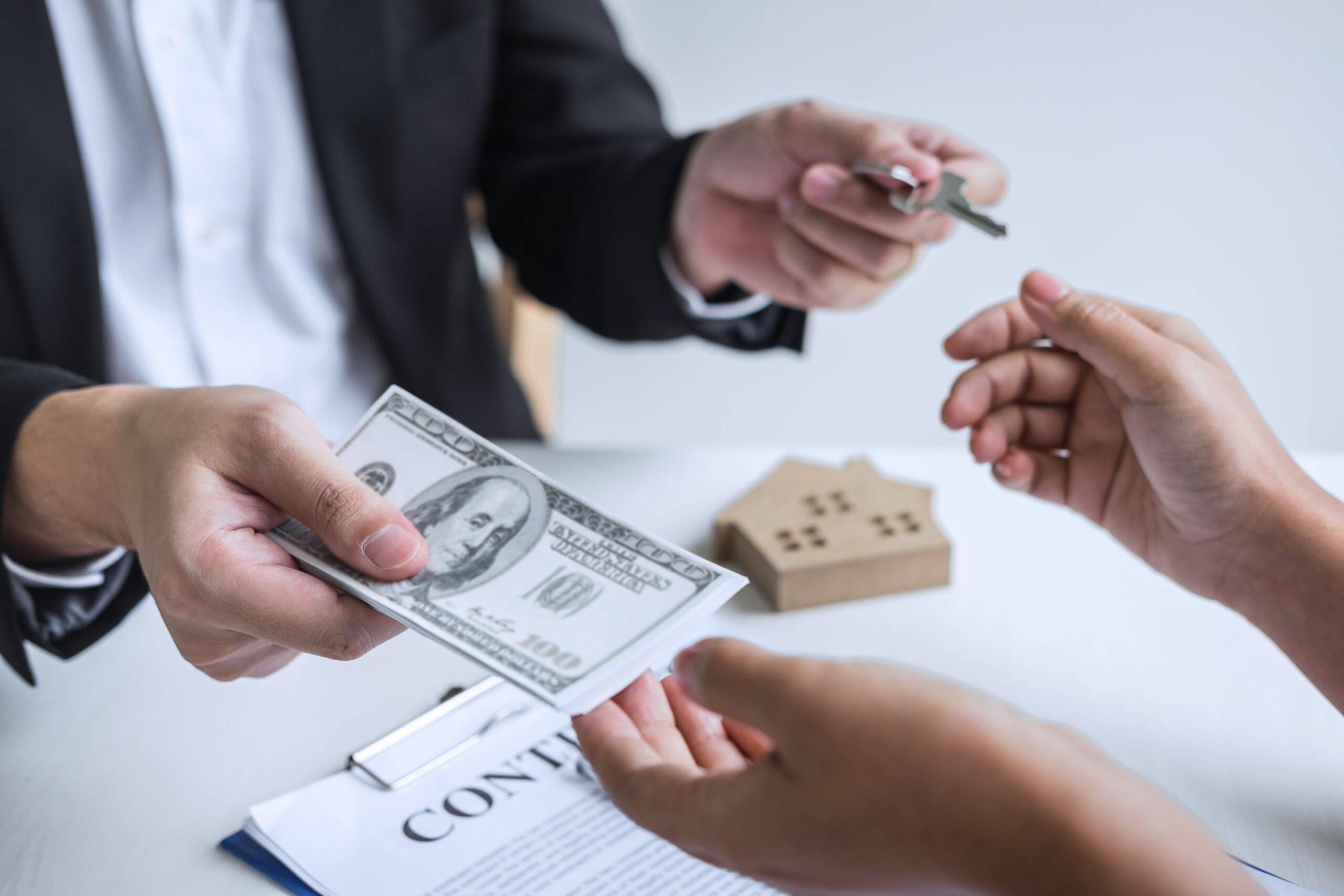estate agent broker receiving money from client